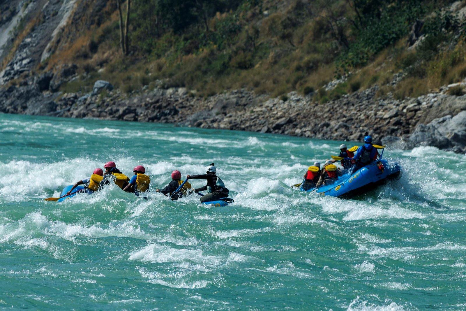 Fleet of rafts on the Ganga river ready for a rafting run in Rishikesh