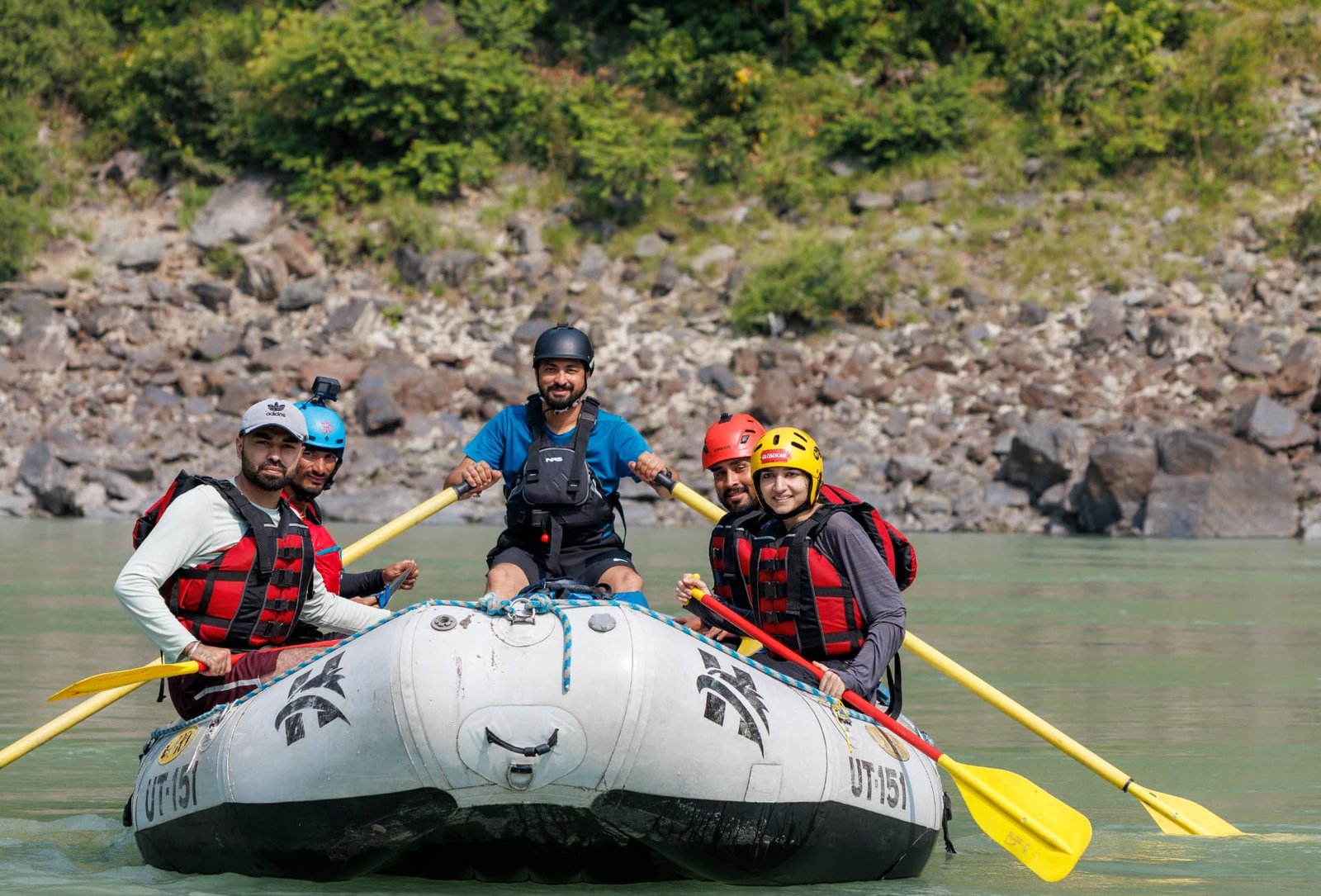 Rafting crew working together through a rapid on the Ganga near Rishikesh