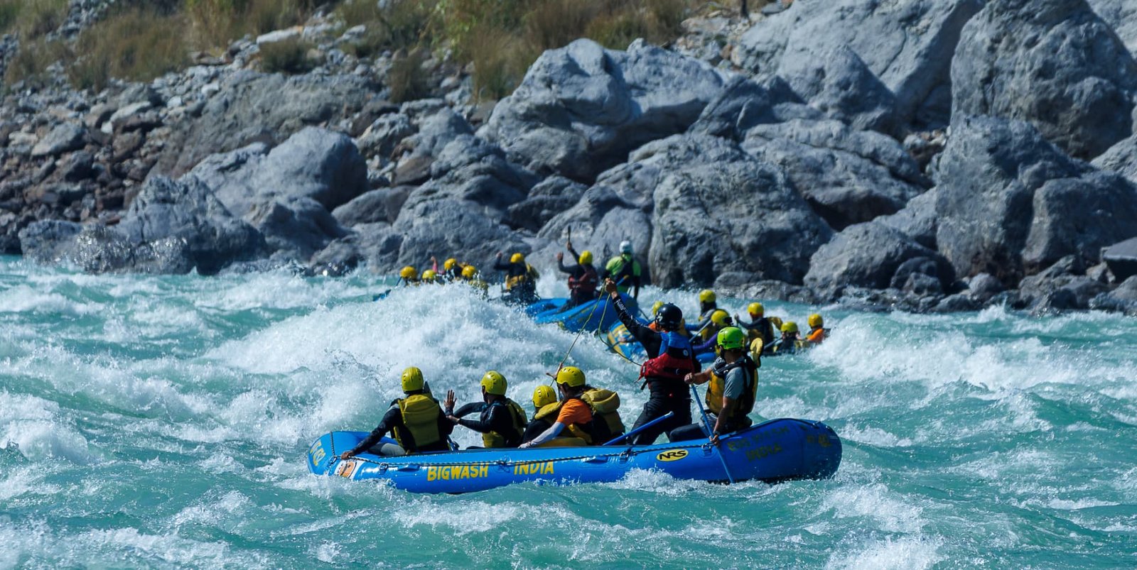 Rafting crew punching through a big wash rapid on the Ganga at Shivpuri