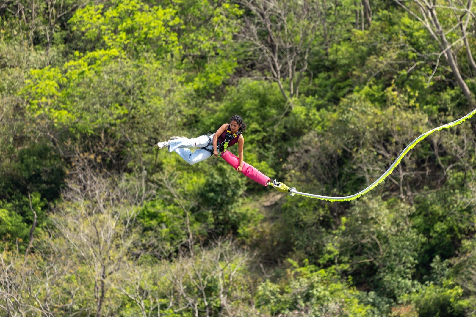 Rider swinging out across the Ganga gorge on the giant swing at Adventure Island Rishikesh